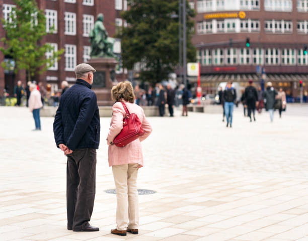 Hamburg, Germany - Rear view of a couple overlooking a city square in central Hamburg.