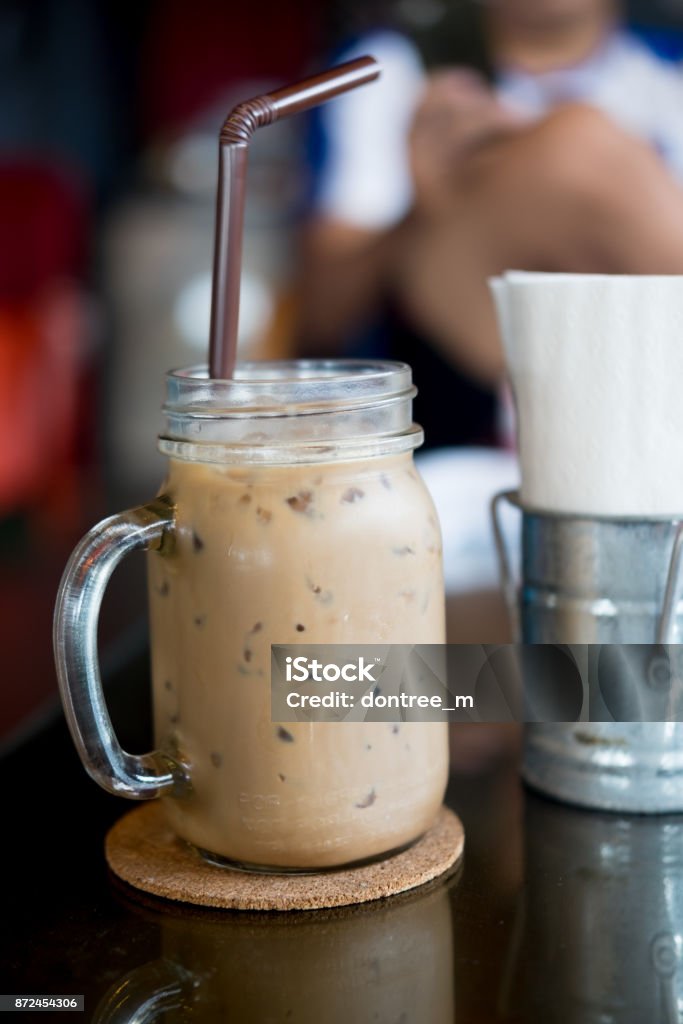 https://media.istockphoto.com/id/872454306/photo/glass-mason-jar-with-ice-coffee-on-wood-table-selective-focus-on-coffee-cup.jpg?s=1024x1024&w=is&k=20&c=OHCG4wHW4i7EwkCKSUzEnAENsmMY-lKOIYSFkvWB4wc=