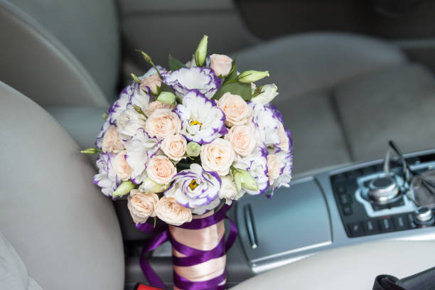 istock Wedding bouquet in the car. 872456782