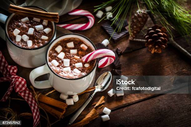 Two Homemade Hot Chocolate Mugs With Marshmallows On Rustic Wooden Christmas Table Stock Photo - Download Image Now