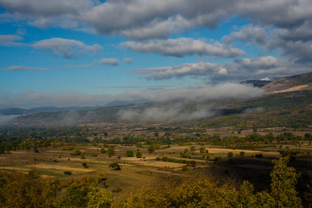 istock Beautiful mountain autumn landscape with a fog 872461490