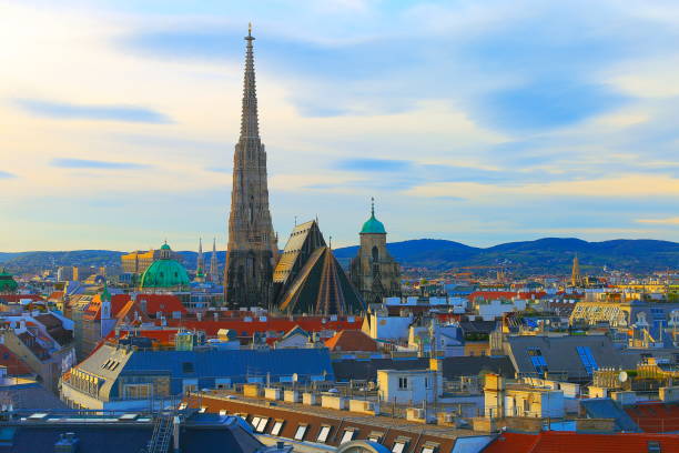 istock Above Beautiful Vienna Cityscape panorama, with St. Stephen's Cathedral, impressive building architecture and urban skyline at dramatic dawn – Vienna , Austria 872465208