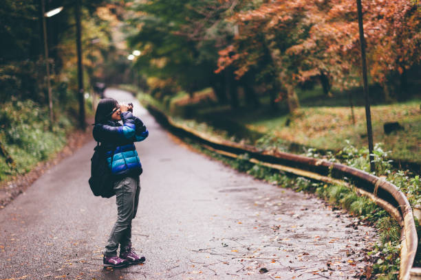 istock Young Woman Taking Photos 872468380
