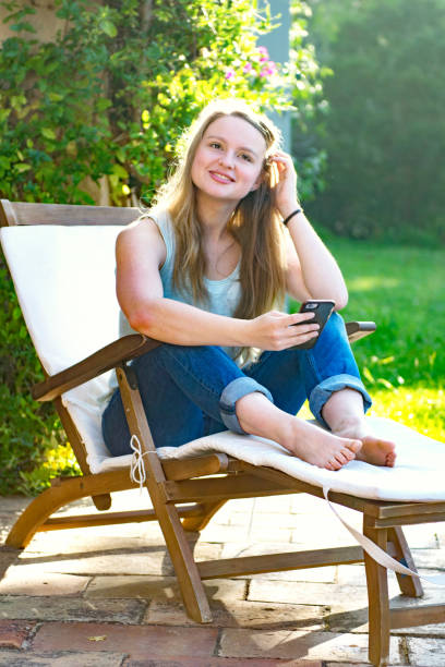 istock Young woman with cell phone 872476276