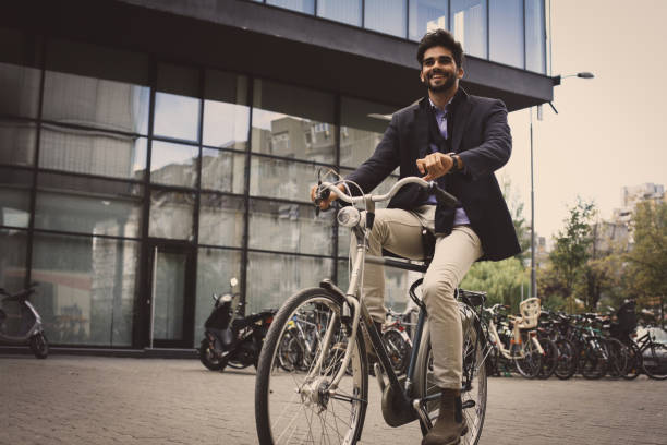 istock Arabian businessman on bike. 872476388