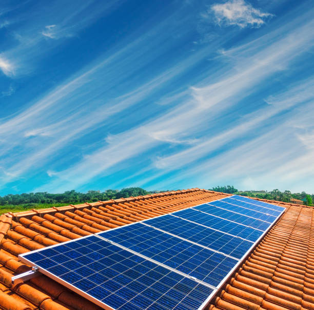 Solar Panel Photovoltaic installation on a Roof, alternative electricity source stock photo