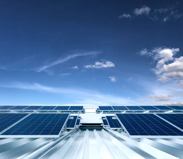 Solar Panel Photovoltaic installation on a Roof of a building, alternative electricity source stock photo