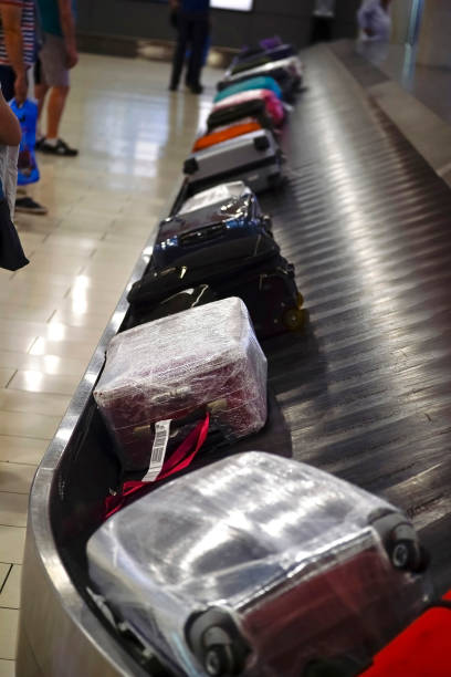 istock The movement of baggage on a conveyor belt 872483538
