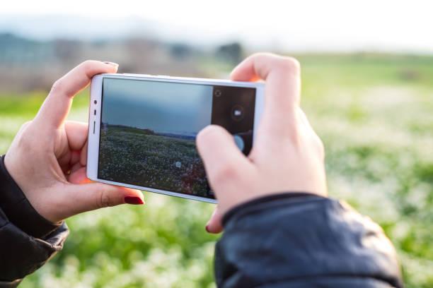 istock Teenager taking landscape photos 872491968