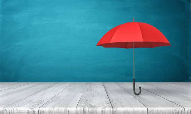 render 3d de un solo paraguas clásico rojo con un pie de dosel abierto encima de un escritorio de madera sobre fondo azul - safety business umbrella parasol fotografías e imágenes de stock