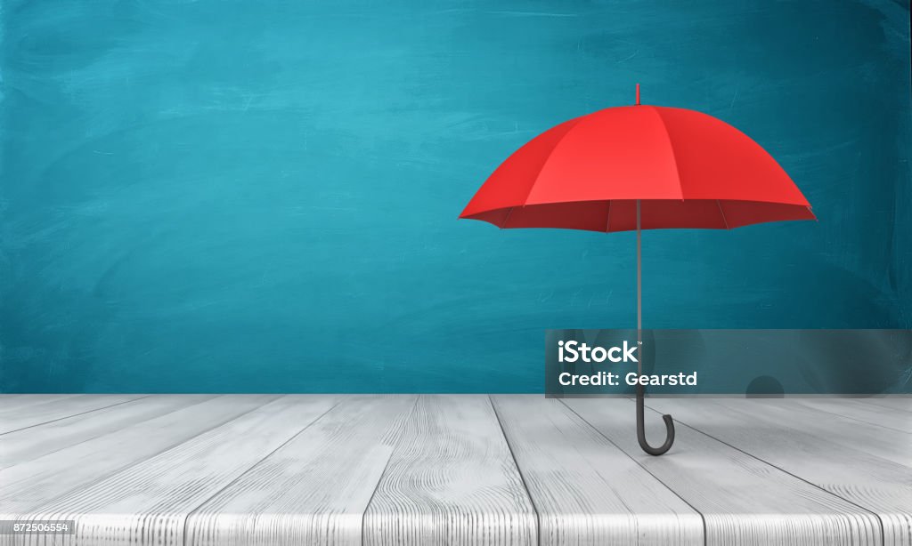 3d rendering of a single red classic umbrella with an open canopy standing above a wooden desk on blue background 3d rendering of a single red classic umbrella with an open canopy standing above a wooden desk on blue background. Business insurance. Safety measures. Hide from problems. Umbrella Stock Photo