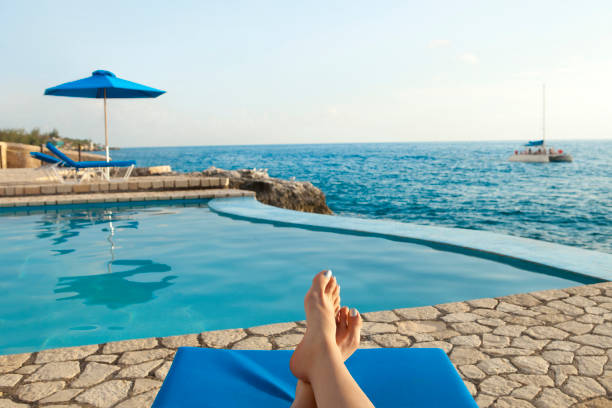 Relaxing by the Pool Near Caribbean Sea stock photo