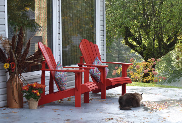 istock Two Red Chairs on Patio in the Autumn (New Brunswick Canada) 872518674
