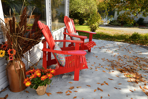 Two Red Chairs on Patio in the Autumn (New Brunswick Canada)
