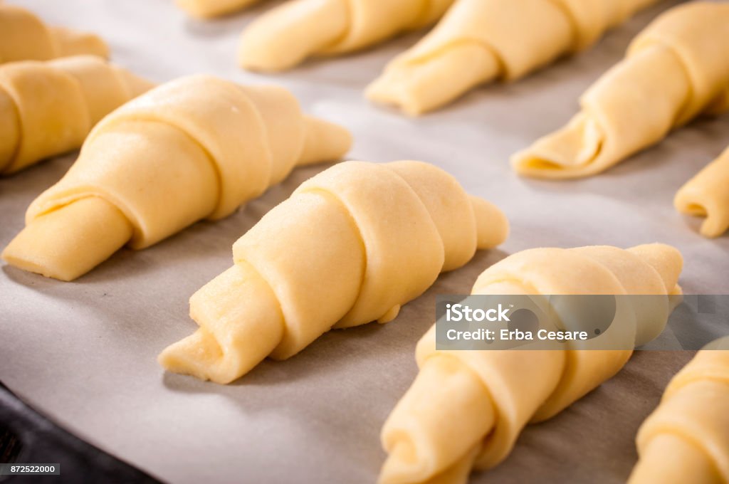 Prepared croissants Prepared croissant for baking.Selective focus on croissant in the middle Croissant Stock Photo