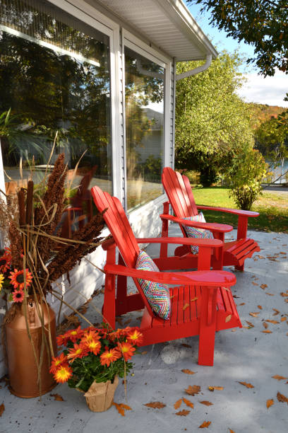 istock Two Red Chairs on Patio in the Autumn (New Brunswick Canada) 872522958