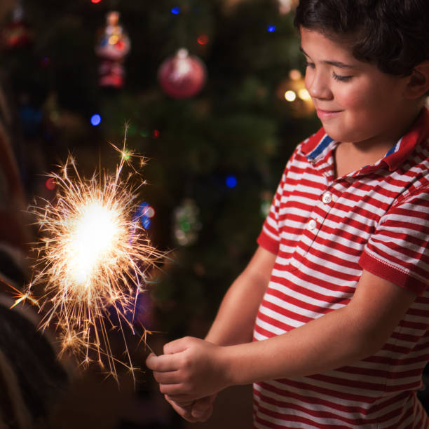 istock Young boy hold burning sparkler and smile 872523308