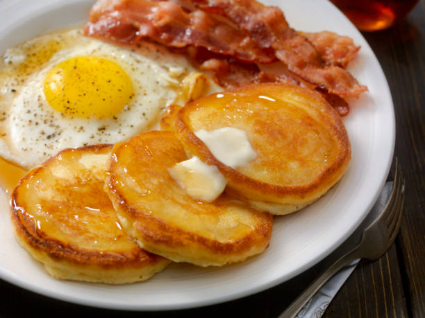 Grand Slam Breakfast - Pancakes, Bacon and Eggs Grand Slam Breakfast - Pancakes, Bacon and Eggs cooked selective focus indoors studio shot stock pictures, royalty-free photos & images