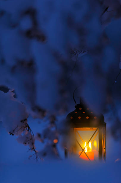 istock Candle lantern in the snow 872548762