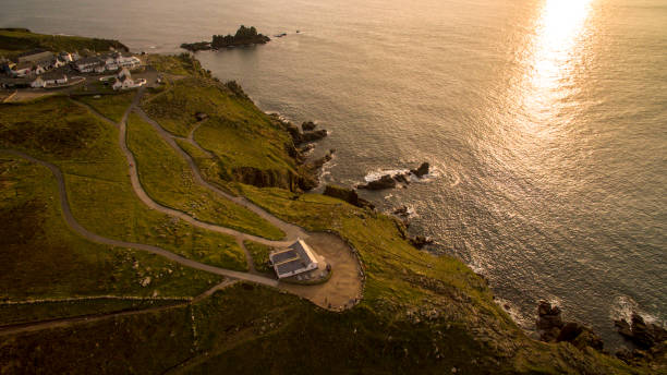 istock Aerial Drone Image of Lands End Whilst Sun is setting 872549248