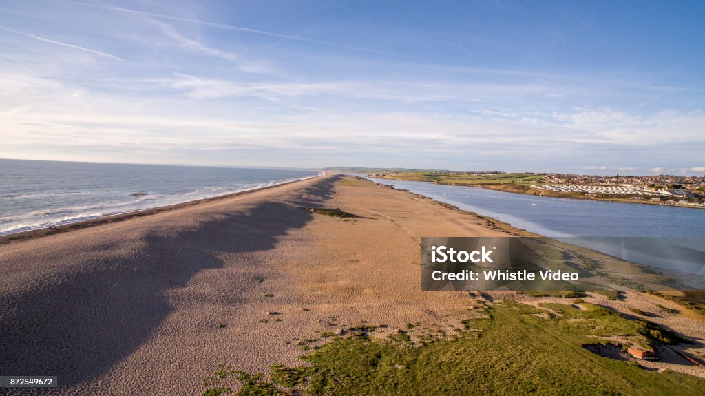 Aerial Drone Shot of Chesil Beach in Portland Dorset Summer scene of British Beach Aerial View Stock Photo