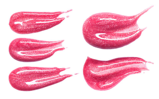 istock Set of different lip glosses smear isolated on white. Smudged makeup product sample. 872552368