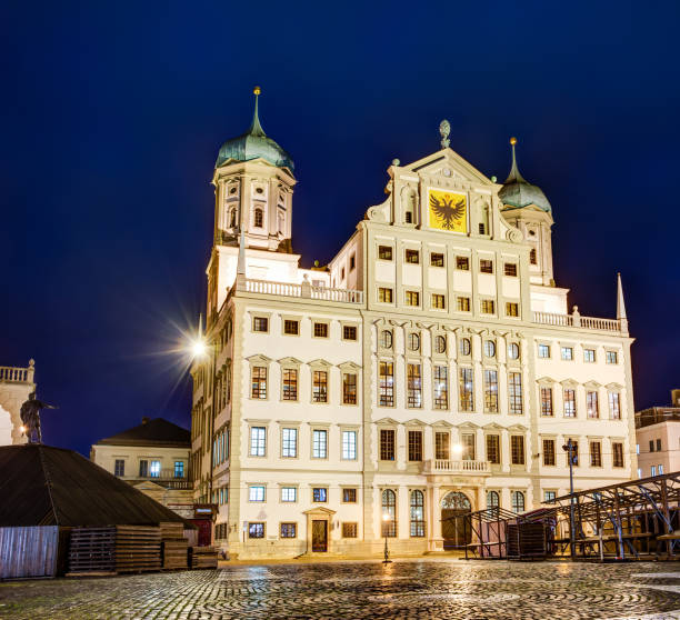 istock Illuminated town hall of Augsburg at night 872553142