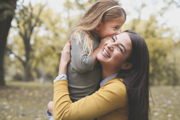 istock Mother and daughter have fun outside. 872553866