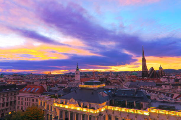 istock Above Beautiful Vienna Cityscape panorama, with St. Stephen's Cathedral, impressive building architecture and urban skyline at dramatic sunset – Vienna , Austria 872554992