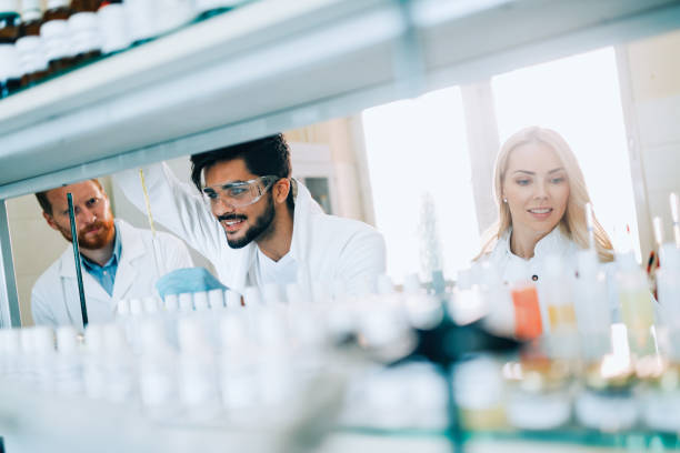 istock Group of chemistry students working in laboratory 872558098