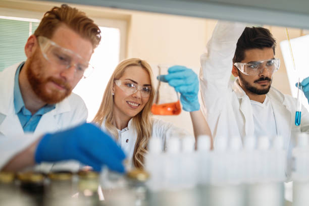 istock Group of chemistry students working in laboratory 872558624