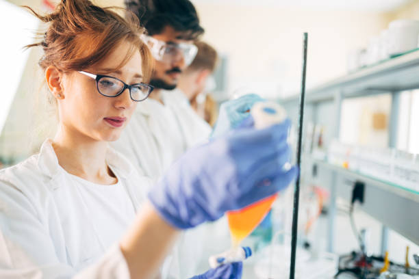 istock Young students of chemistry working in laboratory 872560910
