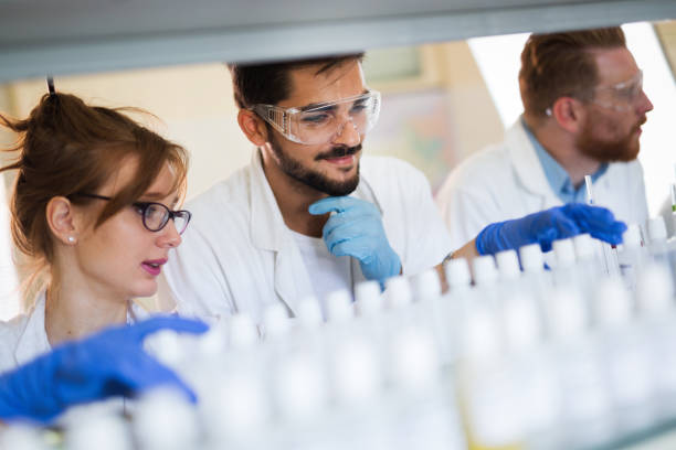 istock Group of chemistry students working in laboratory 872561550