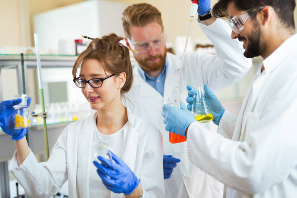 istock Group of chemistry students working in laboratory 872561926