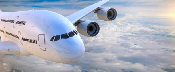istock Commercial airplane flying above clouds 872564632
