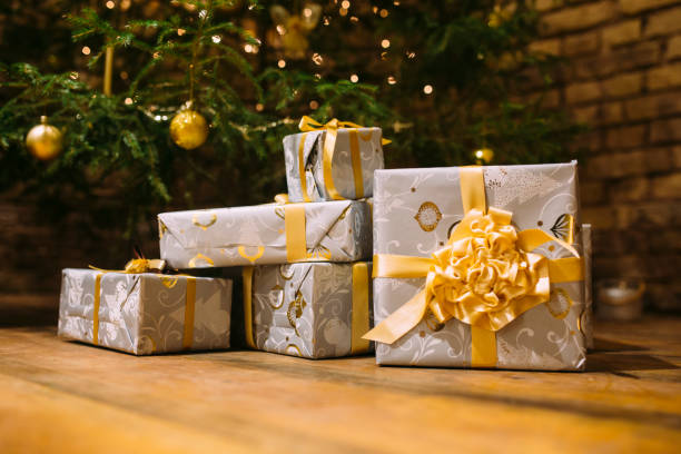 istock Decorated Christmas with bows presents under the christmas tree 872564866