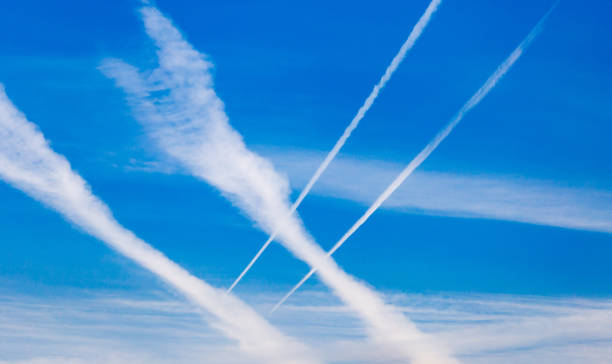 istock traces of an airplane on a blue sky 872566004