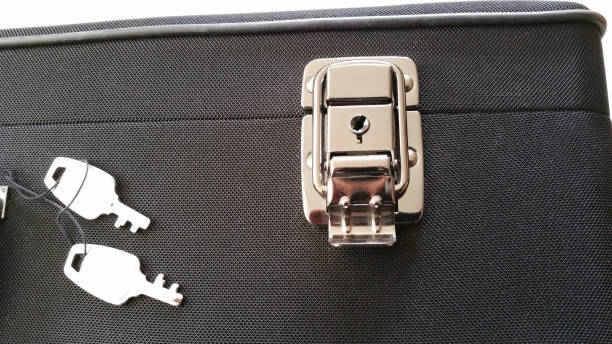 istock Saxophone case close up of chrome catch with keys 872568398