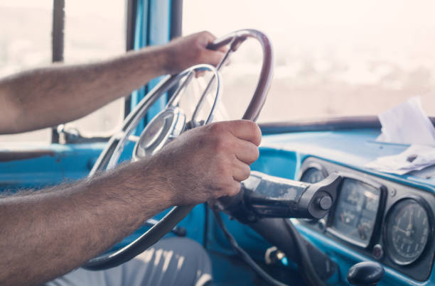 istock Man driving truck 872569174