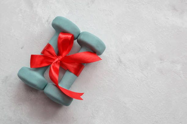 istock Dumbbells are a great gift for the new year. Christmas 2018. 872569656