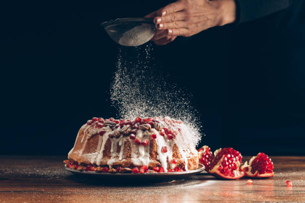 istock woman powdering christmas cake 872571958