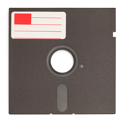 Old Retro Computer Disc with Copy Space Label Isolated on White Background.