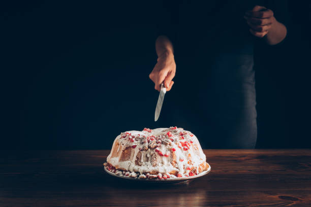 istock woman cutting traditional christmas cake 872572294