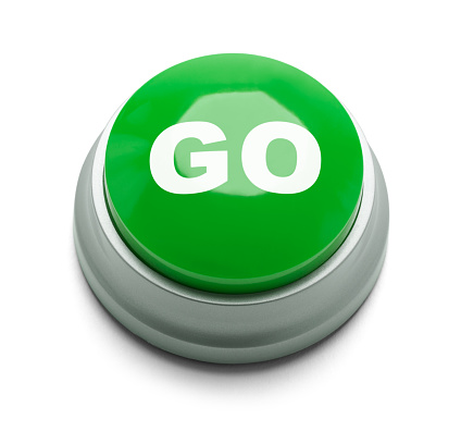 Large green button with the word go on it isolated on a white background.