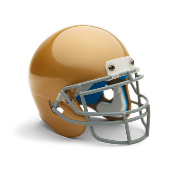 Gold Football Helmet Gold Helmet Angle View with Copy Space Isolated on White Background. face guard sport photos stock pictures, royalty-free photos & images