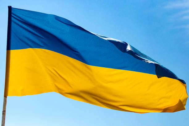 istock flag of Ukraine against the blue sky 872573210