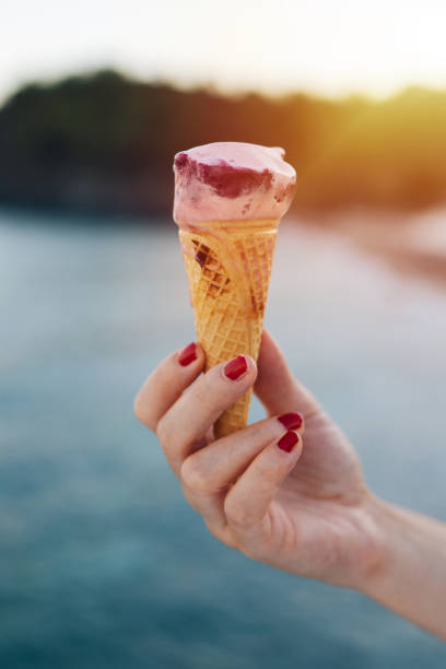 istock Woman eating ice cream 872575894
