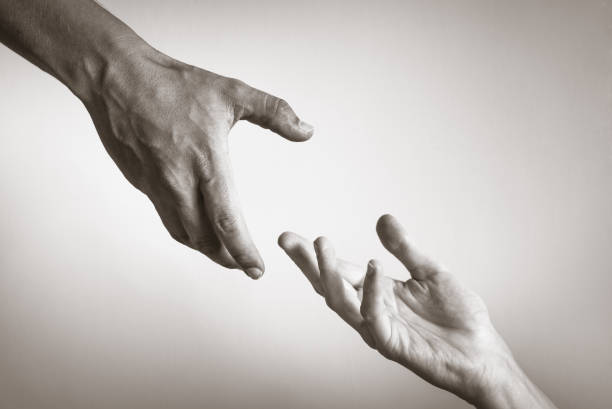 Helping hand Helping hand against white background. a helping hand photos stock pictures, royalty-free photos & images