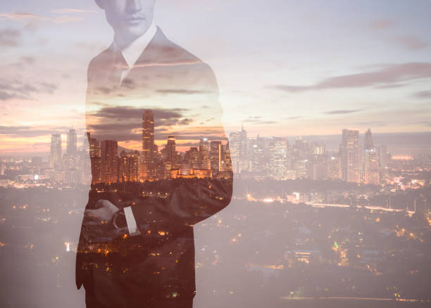 istock Businessman in the city, double exposure 872576394