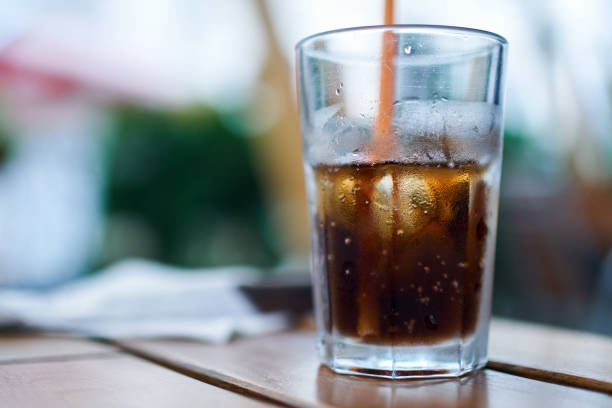 istock Glass of coke with ice 872582896